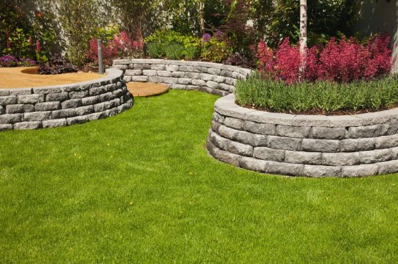 retaining walls on manicured garden by Bunbury Landscaping